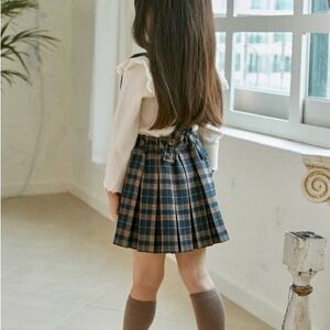 Suspenders skirt pleated. blue and brown plaid. Brand is the beige